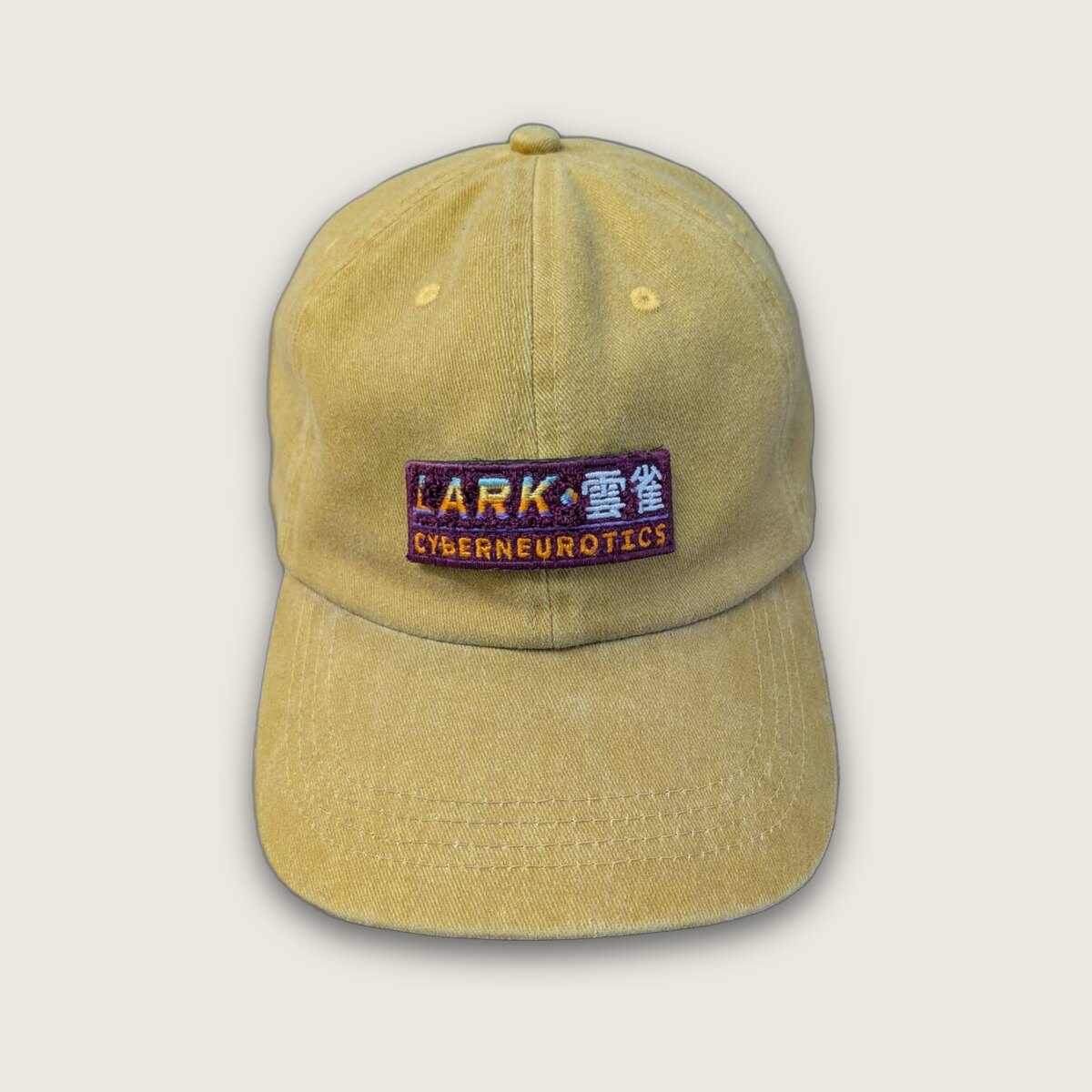 Lark Field Cap in mustard with embroidered logo patch